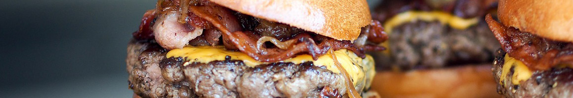 Eating American (Traditional) Burger at Buffalo Grill restaurant in Little Rock, AR.